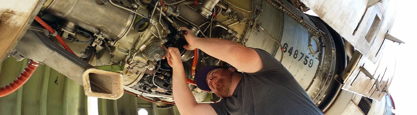 man working on an airplane