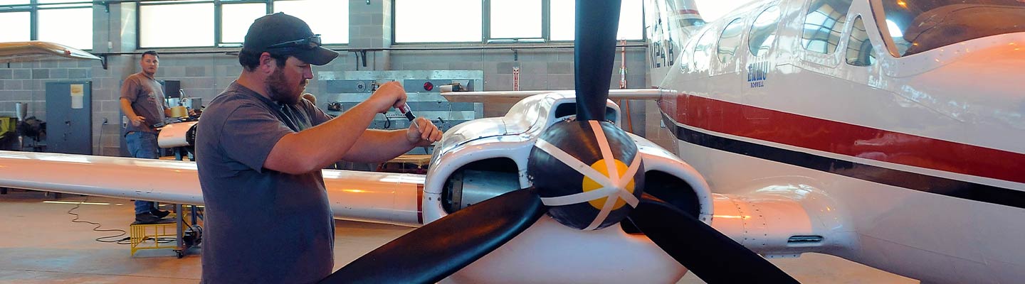 man working on an airplane