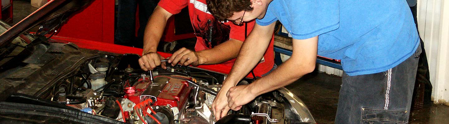 2 people working on a car