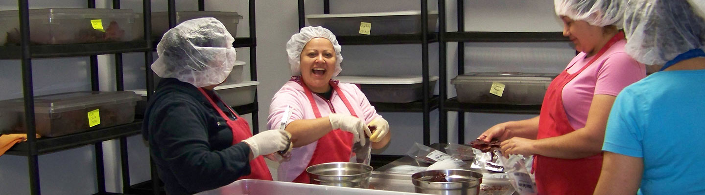 smiling people in working in food service